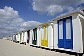Colourful cottages/cabins on the beach, Netherlands.