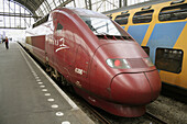 French Thalys (TGV) express train to Paris waiting in Amsterdam central station, Holland, Netherlands