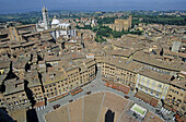 Piazza del Campo and cathedral in background, Siena. Tuscany, Italy