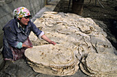 Woman preparing lavash (Armenian cracker bread), Bjni. Armenia