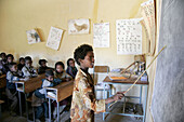 Girl pointing at the blackboard in a primary school in Adigrat. Ethiopia