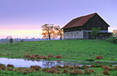 Farm at sunset. Masurian Lakes. Warmia and Masuria. Poland