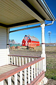 Western Development Museum and Village, red barn, porch view. North Battlerford. Saskatchewan, Canada