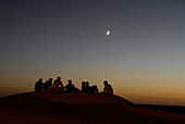 A group of people talking, camping in the desert, Offroad 4x4 Sahara Desert Tour, Bebel Tembain area, Sahara, Tunisia, Africa, mr