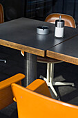 Table and chairs in a Cafe, Medienhafen, Düsseldorf, North Rhine-Westphalia, Germany