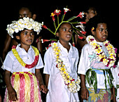 south pacific  Fiji Vitu Levu Nananu I Ra school boys in ceremonial dresses with flowers