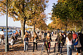Switzerland Zuerich, Zurich,  lake promenade in autumn , people