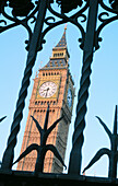 Ornate iron fence and Big Ben. London. England