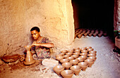 Potter at work. Dades Valley. Morocco