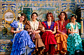 Women with traditional custumes in Plaza España. Seville. Spain