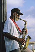 Musician playing on boat on Mississippi river, New Orleans. Louisiana, USA