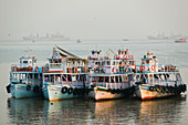 Harbor ferries by Gateway of India in late afternoon, Bombay. Maharashtra, India (2004)