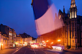 Evening View of Place de la Reunion & Temple St-Etienne Church with French Flag. Mulhouse. Alsace (Haut Rhin). France.