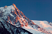 View towards Aiguille du Midi Peak (elev.3800 m/12,467Ft) at Sunset/ Winter. Chamonix. Mont-Blanc. Haute-Savoie. French Alps. France.