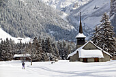 Kandertal Valley- Town Church & Cross Country Skiers / Winter. Kandersteg. Bern. Switzerland.