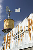 Windmill & Water Cistern by Tarantula Railroad Station. Grapevine (Dallas Area). Texas, USA.
