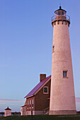 Tawas Point State Park. Tawas Point Lighthouse on Lake Huron. Sunset. Tawas City. Michigan. USA.