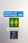 Toilet sign at gas filling station. Germany