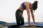 Woman practicing yoga. Utah, USA