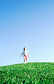 Girl running on hill