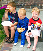 Boys eating bagels