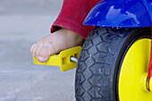Toddler foot on toy bike