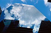Glass building with cloud reflections. NYC, NY. USA