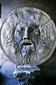 Bas-relief known as Mouth of Truth according to an old legend, in the porch of Santa Maria in Cosmedin church. Rome. Italy