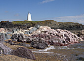 Lighthouse and Pillow Lava Rock, Llanddwyn Island, Anglesey, North Wales