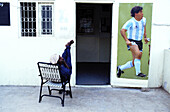 Poster of Maradona on the entrance door of Shiddi soccer club. Lyari district, Karachi. Sindh province, Pakistan