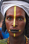 Niger. A Wodaabe-Bororo man with his face painted for the annual Gerewol male beauty contest...