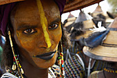 Niger. A Wodaabe-Bororo man with his face painted for the annual Gerewol male beauty contest...