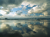 Clouds and Playa Larga beach. Biscay. Spain