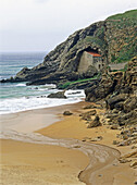 Santa Justa cave chapel beside beach. Ubiarco. Cantabria, Spain
