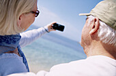 ack view, Beach, Beaches, Camera, Cameras, Caucasian, Caucasians, Color, Colour, Contemporary, Couple, Couples, Daytime, Exterior, Female, Gray-haired, Grey-haired, Horizontal, Human, Look, Looking, M