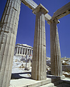 Columns, Propylaea colonnade & parthenon, Acropolis ruins, Athens, Greece.