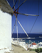 Old windmill & harbour, Mykonos, Greece.