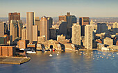 Boston, at sunrise as seen from above Boston Harbor. Massachusetts. USA.