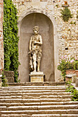 Renaissance marble statue of mythological being standing in niche, in the Giardino Giusti, Verona, Italy