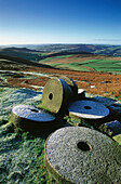 Frost covered millstones under Stanage Edge. Peak District National Park. Derbyshire. England