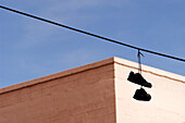 Shoes hanging from power line
