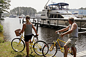 Virginia, Chesapeake, Intracoastal Waterway, Great Bridge Pier, boats, couple, bicycles