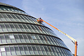 Greater London Authority building with window cleaners. London. England