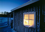 Candles in a frosty window. Sweden