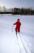 A three years old girl skiing at winter. Medle. Västerbotten, Sweden