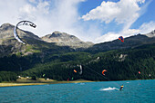 Kite surfing on lake Silvaplaner, Upper Engadin, Grisons, Switzerland