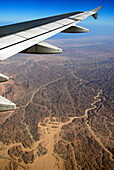 Aircraft wing above Egytian desert, Egypt, Africa