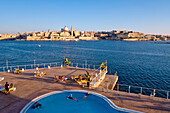 View over a swimming pool on the waterfront at the town Valletta, Sliema, Malta, Europe