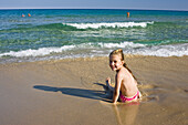 little girl playing at the beach, Sardinia, Italy