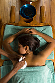 Woman receiving an Ayurveda therapy, Ayurvedic massage treatment, Shanti Ananda Resort und Spa, Mauritius